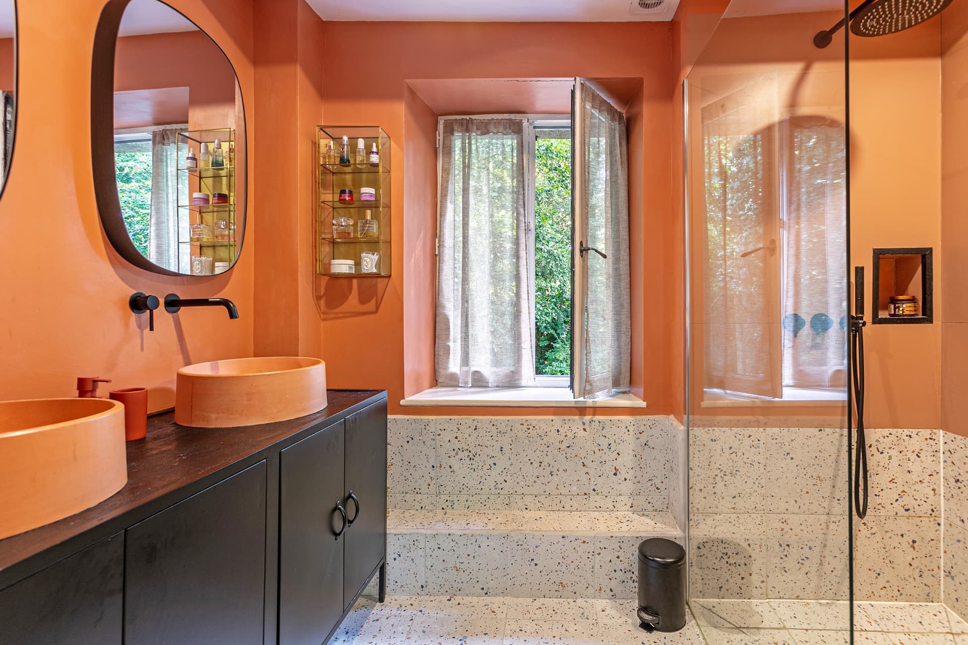 En-suite with terrazzo tiles, twin basins and walk-in shower