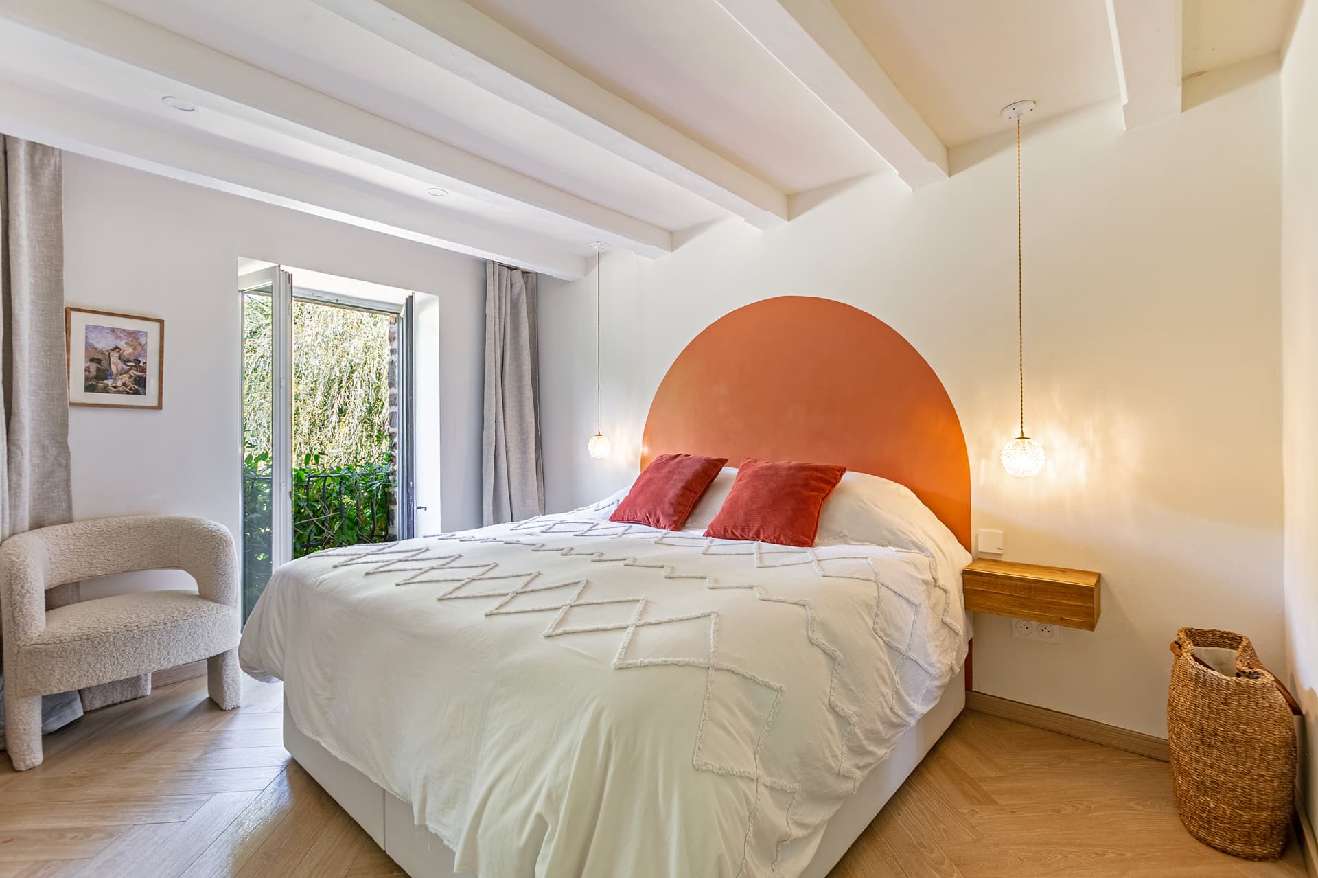 Terracotta bedroom with French windows onto the garden